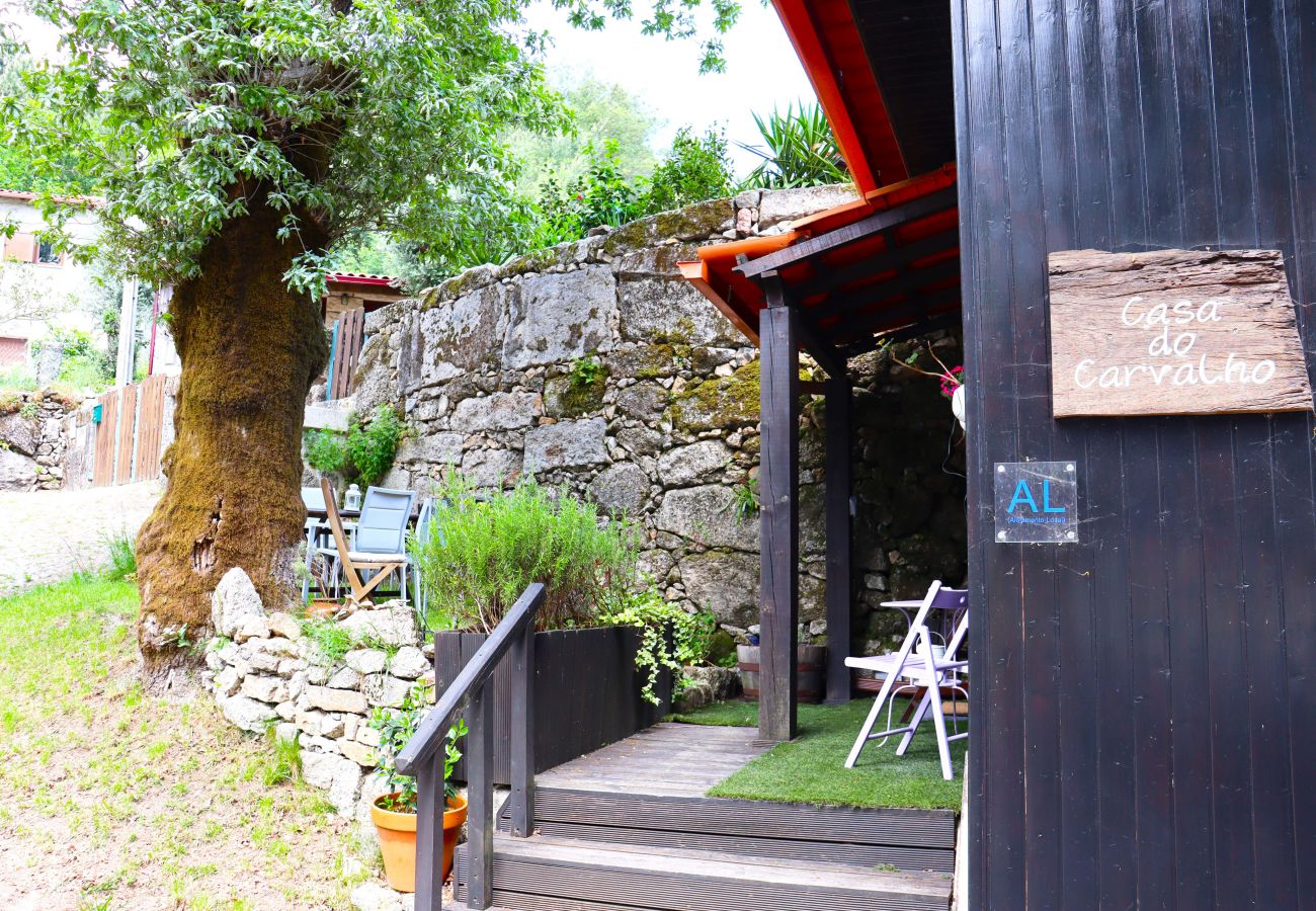 Entrance with garden and outdoor dining area